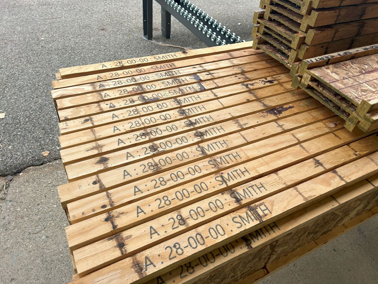 View of I-Joists with labels printed on the them after running through the Badger EWP Processing Center